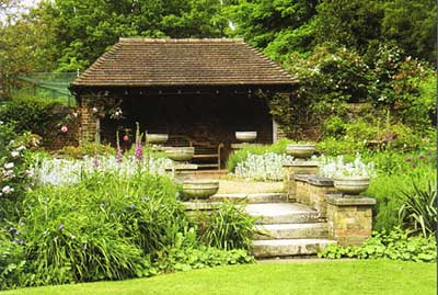 The restored garden pavilion with Lutyens-style wooden benches